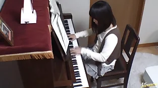 Piano tutor rear nails his pupil throughout the piano keys
